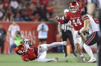 Oct 26, 2024; Houston, Texas, USA; Houston Cougars defensive back A.J. Haulcy (2) makes an interception during the fourth quarter against the Utah Utes at TDECU Stadium.
