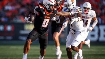 Oregon State Beavers running back Anthony Hankerson (0) fight off Idaho State defense during the second half on Saturday