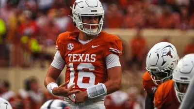 Texas Longhorns quarterback Arch Manning (16) hands off the ball during the game against Texas Tech at Darrell K Royal Texas Memorial Stadium on Friday