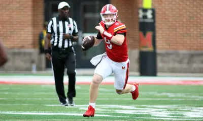 Aug 31, 2024; College Park, Maryland, USA; Maryland Terrapins quarterback Billy Edwards Jr. (9) signals to a receiver during the second quarter against the Connecticut Huskies at SECU Stadium.