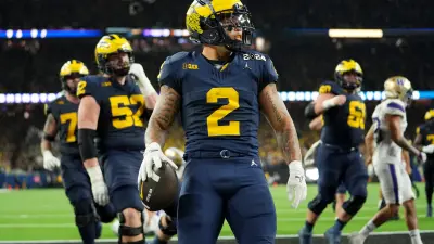 Michigan running back Blake Corum runs the ball in for a touchdown during fourth quarter at the College Football Playoff national championship game against Washington at NRG Stadium in Houston