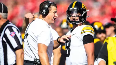 Iowa offensive coordinator and quarterbacks coach Brian Ferentz talks with QB Alex Padilla during the game against Ohio State.