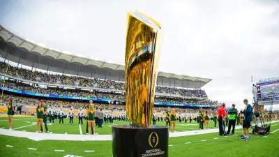 The College Football Playoff National Championship Trophy makes an appearance at the NCAA college football game between Tennessee and Kentucky on Saturday