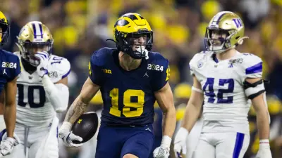 Michigan tight end Colston Loveland scores a touchdown against Ohio State safety Lathan Ransom during the second half at Ohio Stadium in Columbus