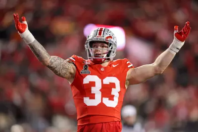 Dec 21, 2024; Columbus, Ohio, USA; Ohio State Buckeyes defensive end Jack Sawyer (33) gets the crowd going during the second quarter against the Tennessee Volunteers at Ohio Stadium.