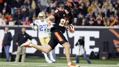 Oregon State TE Jack Velling gains yardage against the UCLA Bruins.