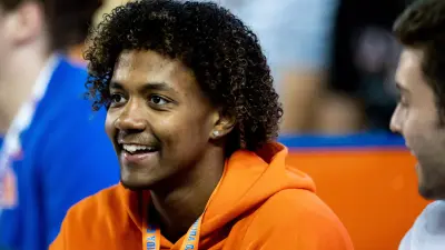 Florida Gators recruit Jaden Rashada smiles on the sideline during the second half against the Florida Gators at Steve Spurrier Field at Ben Hill Griffin Stadium in Gainesville