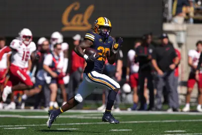 Oct 19, 2024; Berkeley, California, USA; California Golden Bears running back Jaivian Thomas (25) rushes for a touchdown against the North Carolina State Wolfpack during the first quarter at California Memorial Stadium. 