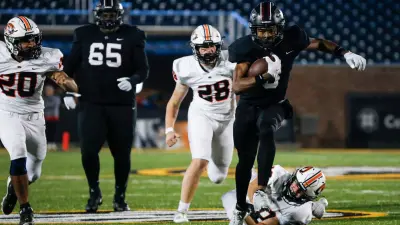 Cardinal Ritter's Jamarion Parker (3) carries the ball for a touchdown on the Republic Tigers during the Class 5 State Championship football game at Faurot Field in Columbia