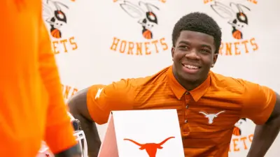 Jerrick Gibson signs his letter of intent to play football at Texas at Hawthorne Middle/High School in Hawthorne