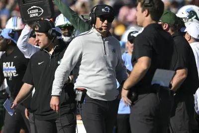 Nov 16, 2024; Annapolis, Maryland, USA; Tulane Green Wave head coach Jon Sumrall walks down the sidelines during the first half against the Navy Midshipmen at Navy-Marine Corps Memorial Stadium.