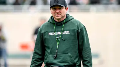 Michigan State's head coach Jonathan Smith walks to the sideline during the Spring Showcase on Saturday