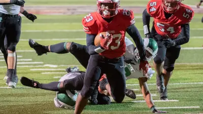 Lincoln's Jordin Thomas gets past St.Mary's defenders to score at touchdown during a varsity football game at Lincoln's Spanos Stadium in Stockton on Oct. 27