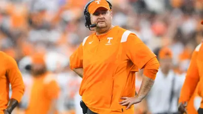 Tennessee head football coach Josh Heupel reacts in the rain on the sidelines during Tennessee's game against Georgia at Sanford Stadium in Athens