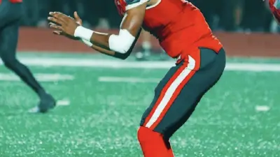 Mike Farrell Sports 2025 2-Star QB Kaegan Chambers from Monroe (NC) gets ready to snap the ball for Monroe HS