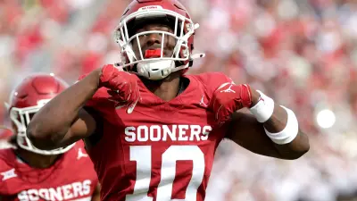 Oklahoma's Kip Lewis (10) celebrates a play in the first half of the college football game between the University of Oklahoma Sooners and the University of Central Florida Knights at Gaylord Family Oklahoma-Memorial Stadium in Norman