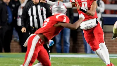 Saraland's KJ Lacey passes against Mountain Brook during the AHSAA Class 6A State Football Championship Game at Jordan Hare Stadium in Auburn