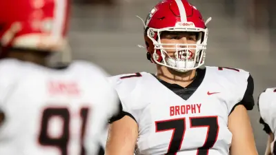 Brophy Prep Broncos tackle Logan Powell (77) prepares for a play against the Basha Bears at Basha High School's football field in Chandler on Sept. 28