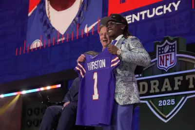Kentucky Wildcats cornerback Maxwell Hairston poses with NFL commissioner Roger Goodell after being selected by the Baltimore Ravens as the 30th pick in the first round of the 2025 NFL Draft at Lambeau Field.