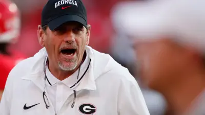 Georgia Offensive Coordinator Mike Bobo on the field during warm ups before the start of a NCAA college football game against UAB in Athens
