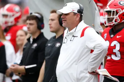 Georgia football analyst Mike Bobo watches from the sideline during the G-Day spring football game in Athens, Ga., on Saturday, April 16, 2022.