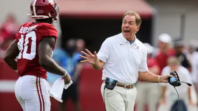 Alabama Head Coach Nick Saban speaks with Kendrick Blackshire as he leaves the field in Bryant-Denny Stadium.