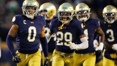 Notre Dame safety Xavier Watts (0) celebrates getting an interception during a NCAA college football game against Virginia at Notre Dame Stadium on Saturday