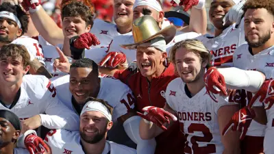 Oklahoma coach Brent Venables poses for a photo wearing the Golden Hat Trophy after the Red River Rivalry college football game between the University of Oklahoma Sooners (OU) and the University of Texas (UT) Longhorns at the Cotton Bowl in Dallas