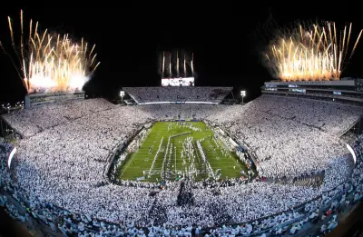 Nov 9, 2024; University Park, Pennsylvania, USA; Fireworks burst overhead as the Penn State Nittany Lions take the field prior to a White Out game against the Washington Huskies at Beaver Stadium. 