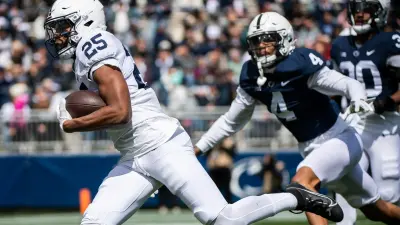 Penn State running back Quinton Martin carries the ball all the way to the end zone to score a touchdown during the Blue-White game at Beaver Stadium on Saturday