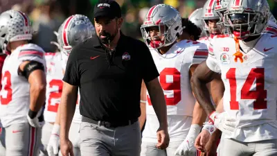 Ohio State Buckeyes head coach Ryan Day leads warm ups prior to the College Football Playoff quarterfinal against the Oregon Ducks at the Rose Bowl in Pasadena