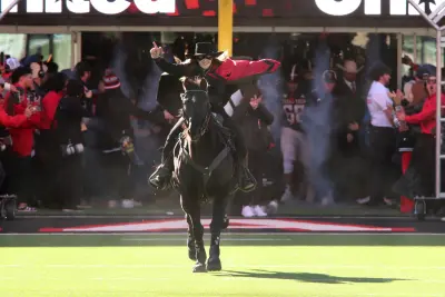 Nov 30, 2024; Lubbock, Texas, USA; Texas Tech Red Raiders quarterback Behren Morton (2) throws against the West Virginia Mountaineers in the second half at Jones AT&T Stadium and Cody Campbell Field. 