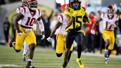 Oregon wide receiver Tez Johnson returns a pass for a touchdown as the No. 6 Oregon Ducks host the USC Trojans Saturday