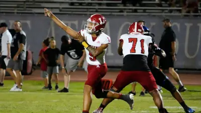 Orange Lutheran Lancers quarterback TJ Lateef (9) throws a pass against the Chandler Wolves during a football game at Chandler High in Chandler on Sept. 8