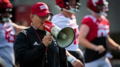 Indiana Head Coach Tom Allen uses his megaphone during Indiana football fall camp at the practice fields on Friday