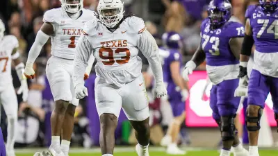Texas Longhorns defensive lineman T'Vondre Sweat (93) celebrates a defensive stop during the Big 12 Championship game against the Oklahoma State Cowboys at AT&T stadium on Saturday