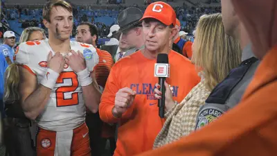 Clemson head coach Dabo Swinney is interviewed by ESPN near quarterback Cade Klubnik (2)
