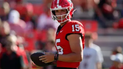 Georgia quarterback Carson Beck (15) warms up before the start of a NCAA college football game against Tennessee Martin in Athens