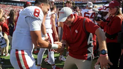 Oklahoma coach Brent Venables celebrates with Oklahoma Sooners quarterback Dillon Gabriel (8) after the Red River Rivalry college football game between the University of Oklahoma Sooners (OU) and the University of Texas (UT) Longhorns at the Cotton Bowl in Dallas