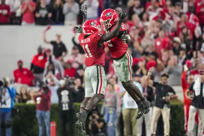 Georgia Bulldogs linebacker Jalon Walker (11) reacts with linebacker Smael Mondon Jr. (2).