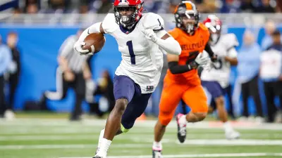 Southfield A&T wide receiver Tashi Braceful runs for a touchdown against Belleville during the first half of the Division 1 state final at Ford Field in Detroit on Sunday