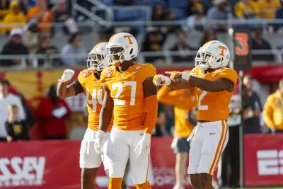 Jan 1, 2024; Orlando, FL, USA; Tennessee Volunteers defensive lineman James Pearce Jr. (27), linebacker Elijah Herring (44) and defensive back Jaylen McCollough (2) celebrate a sack against the Iowa Hawkeyes during the third quarter at Camping World Stadium.
