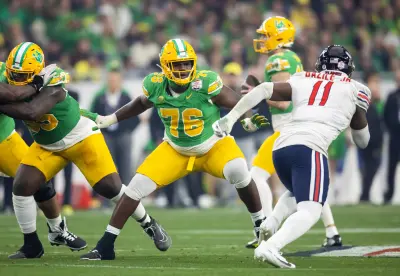 Jan 1, 2024; Glendale, AZ, USA; Oregon Ducks offensive lineman Josh Conerly Jr. (76) against the Liberty Flames during the 2024 Fiesta Bowl at State Farm Stadium. Mandatory Credit: Mark J. Rebilas-USA TODAY Sports 
