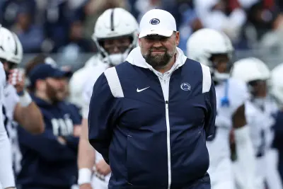 Apr 13, 2024; University Park, PA, USA; Penn State Nittany Lions offensive coordinator Andy Kotelnicki walks on the field during a warmup practice prior to the Blue White spring game at Beaver Stadium.