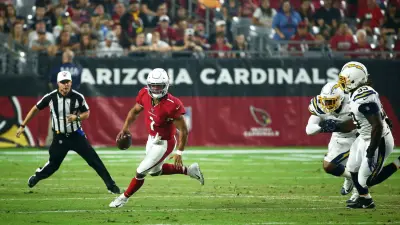 Arizona Cardinals quarterback Kyler Murray (1) eludes Los Angeles Chargers linebacker Chris Peace (40) and defensive tackle Justin Jones (93) in the first half during a preseason game on Aug. 8