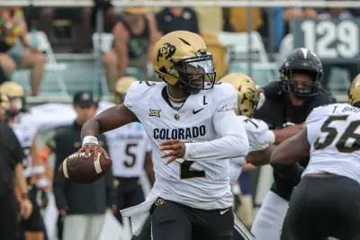 Sep 28, 2024; Orlando, Florida, USA; Colorado Buffaloes quarterback Shedeur Sanders (2) rolls out to pass against the UCF Knights during the first quarter at FBC Mortgage Stadium.