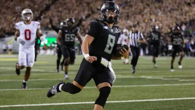 Oregon quarterback Dillon Gabriel scores a touchdown against Ohio State in the fourth quarter at Autzen Stadium Saturday