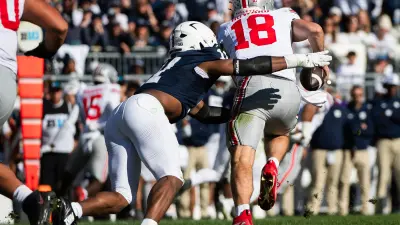 Penn State's Abdul Carter (11) sacks Ohio State quarterback Will Howard in the second half of an NCAA football game