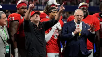 Georgia coach Kirby Smart celebrates with his team after the winning the SEC championship game against Texas in Atlanta