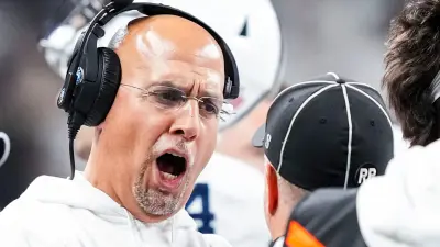 Penn State Nittany Lions head coach James Franklin speaks with an official Saturday